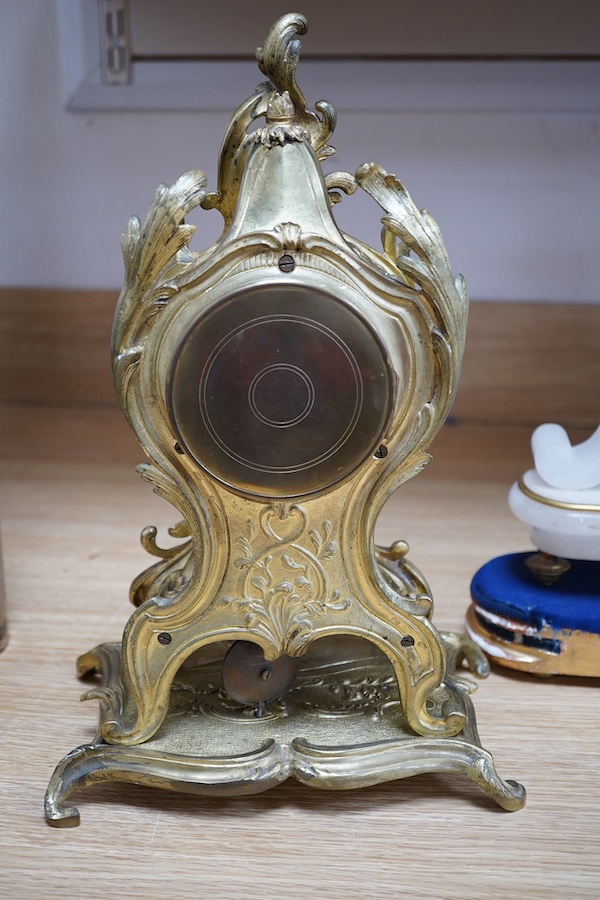 A late 19th century French ormolu mantel clock and another clock in an alabaster case, 39cm. Condition - fair to good